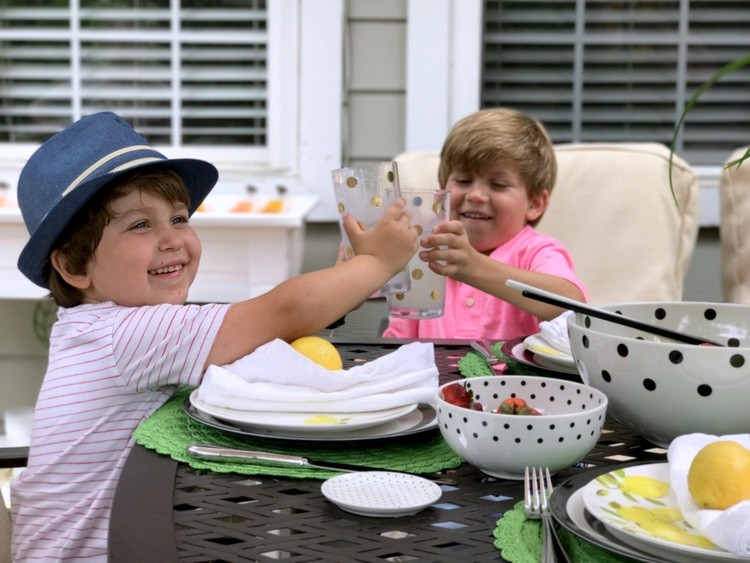 Boys enjoying lemonade on the back deck