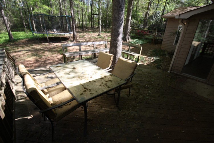 An old, poorly constructed backyard deck