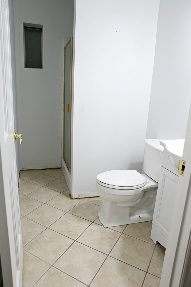 Bathroom before getting a painted stencil floor makeover