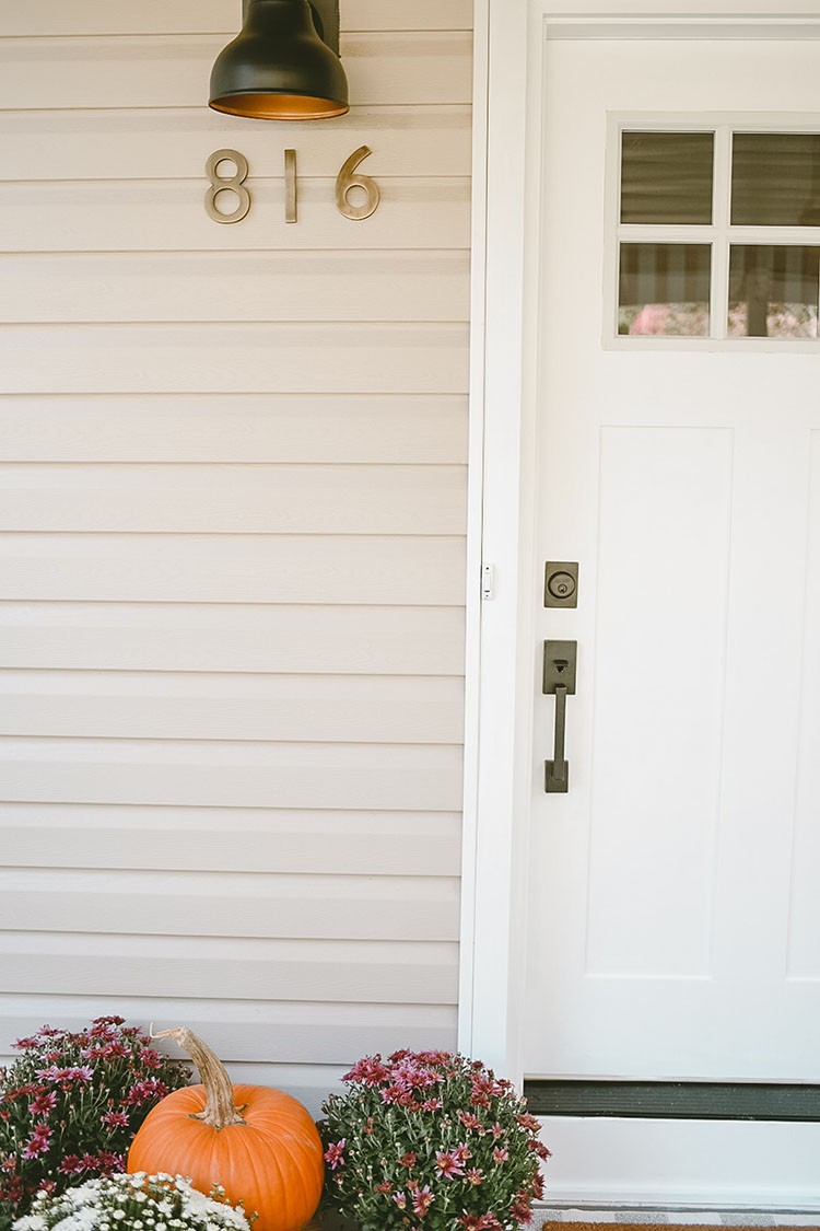 Caitlin Kruse has been wanting to replace her front door since they moved in. With a few simple upgrades, Caitlin's porch is now festive and ready for Fall.