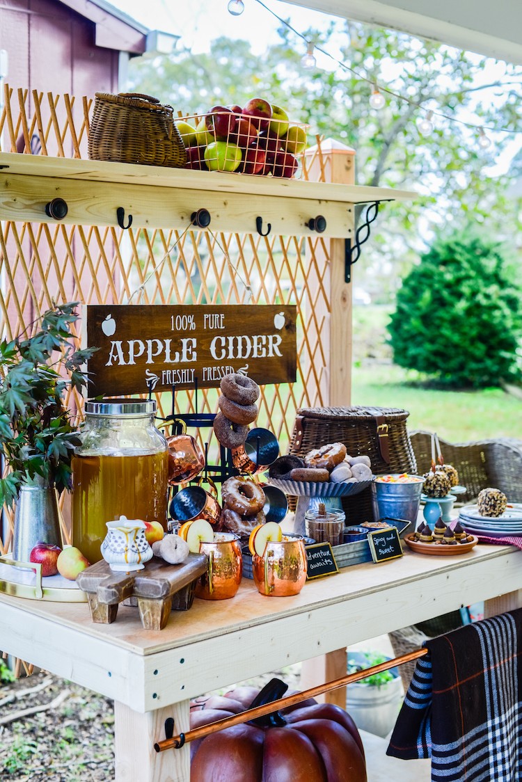 Jennifer Caroll of Celebrating Everyday Life builds a potting bench and styles it as an apple cider bar that any guest will compliment this fall season.