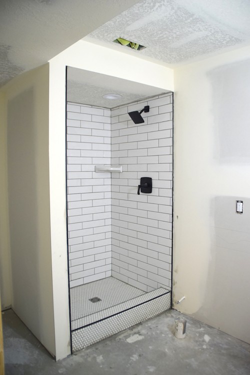 In a few easy-to-follow steps, Natalie Dalpias of The Creative Mom shares how to create a shower stall that is functional, yet stylish for their new basement bathroom.