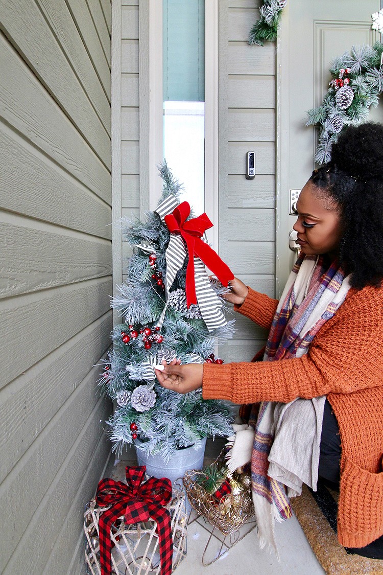 Ashley Basnight of Handmade Haven transforms her front porch for the holidays. Impress your guests with Christmas decorations from The Home Depot.