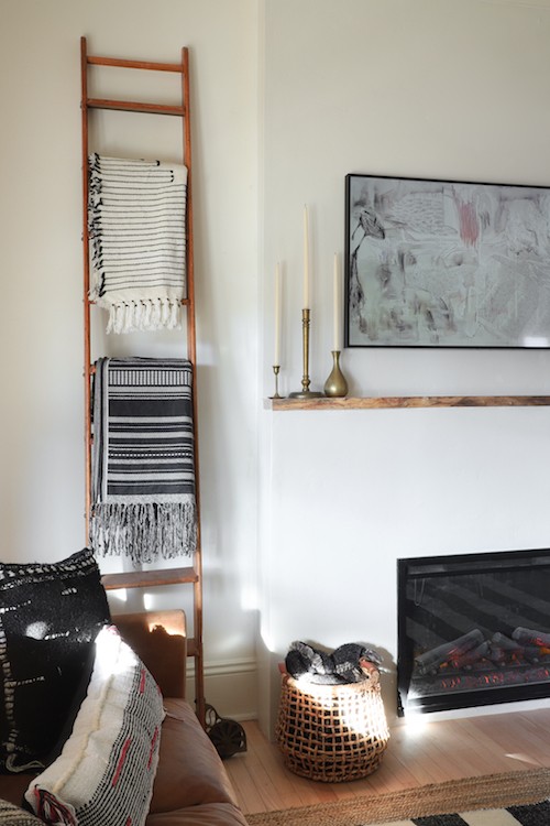 Jenni Radosevich of I SPY DIY transforms her living room into a warm and inviting space by adding a minimalist electric fireplace.