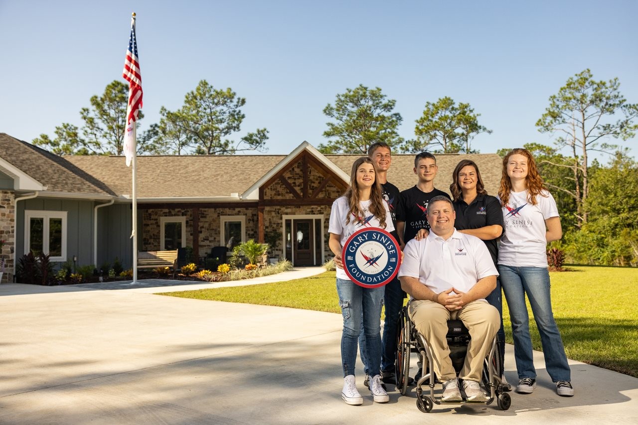 The Prescott family outside their home.