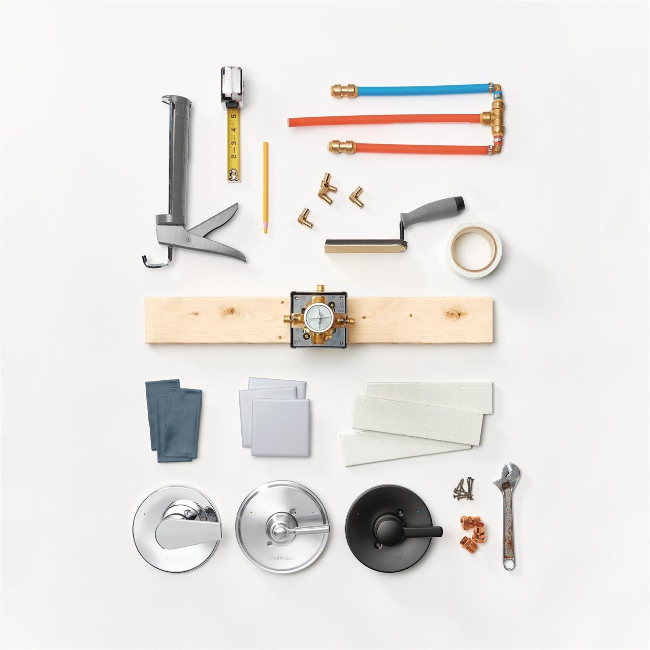 Tools of the installation trade including: a level, trowl, caulking gun, tile, measuring tape, etc.