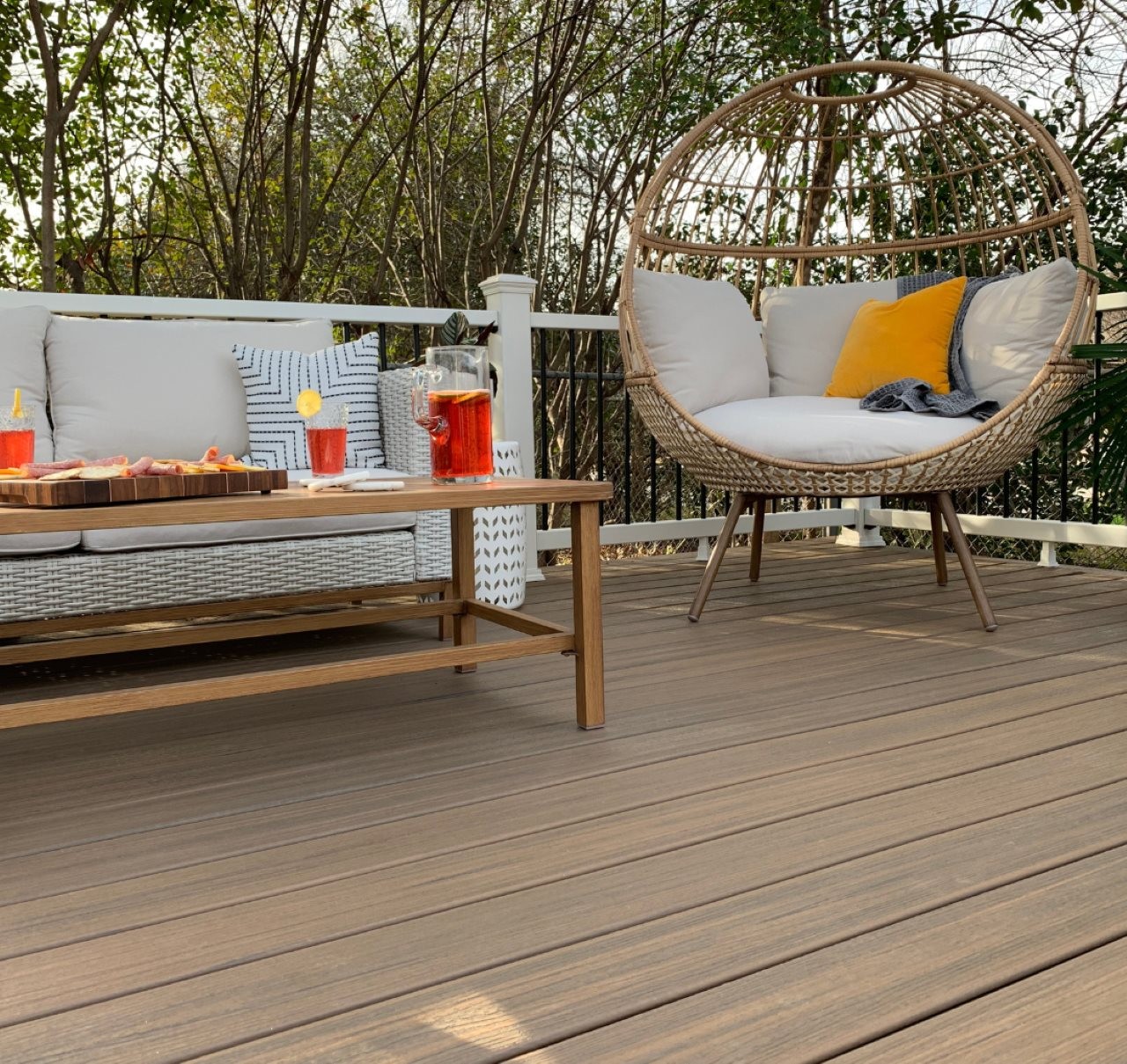 Beautiful deck with comfortable cushioned wicker furinture.