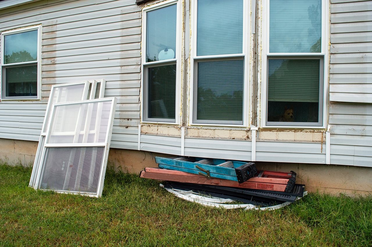 Home in the process of having the old windows removed and will be replaced by the new vinyl windows in their place.