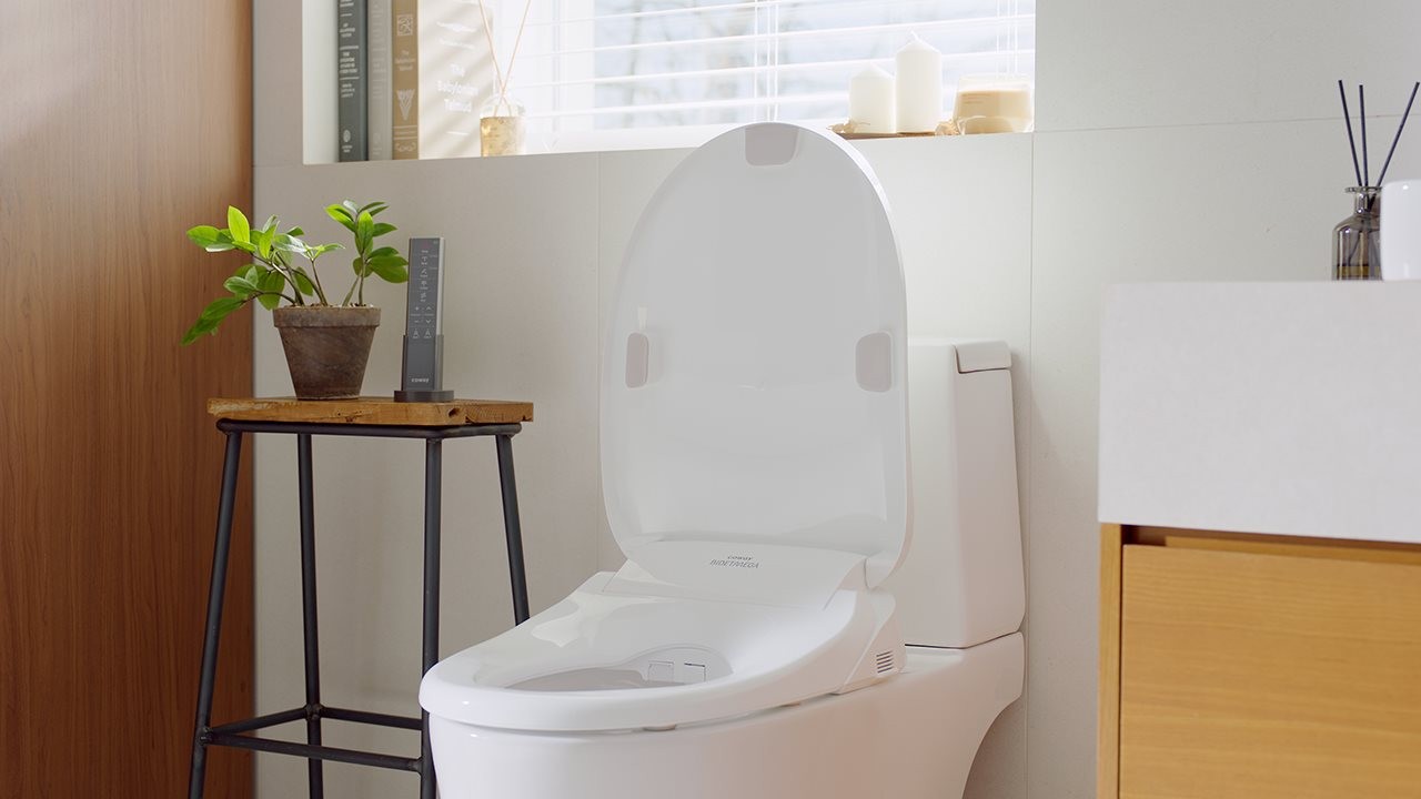 Bidet installed on toilet