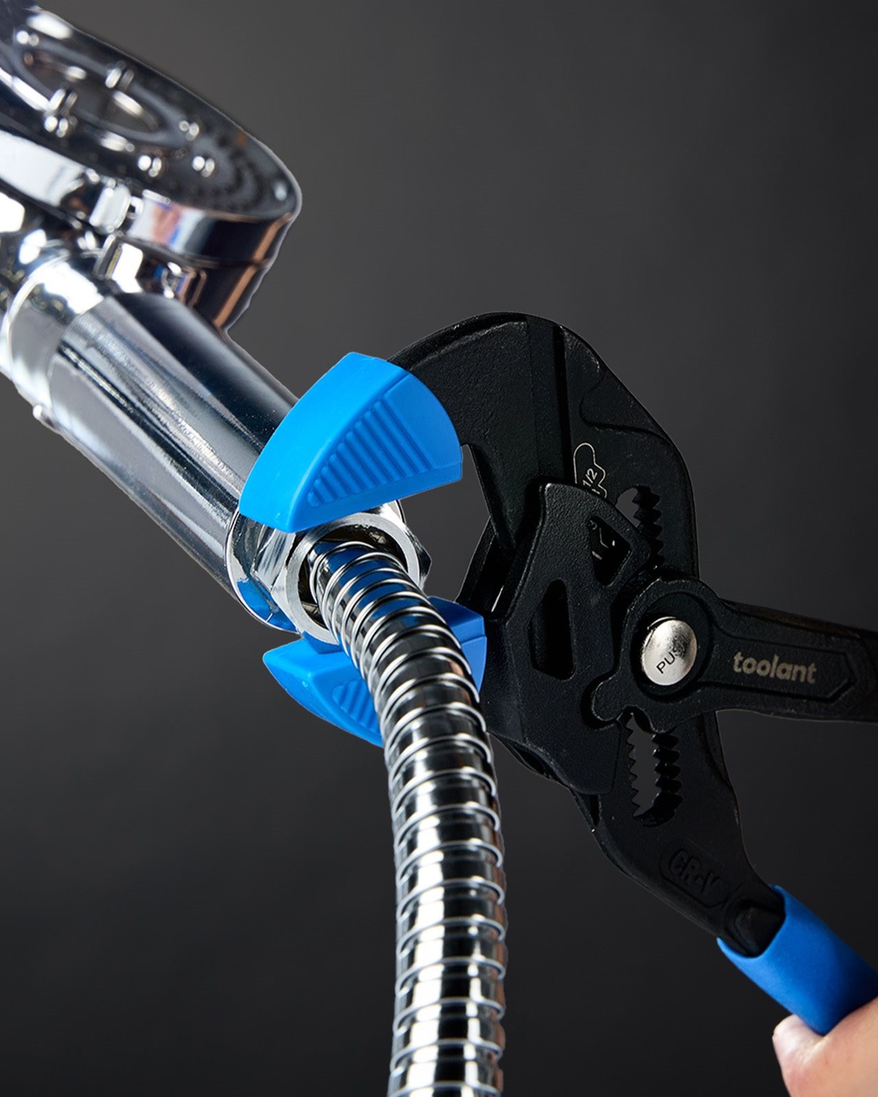 Plier wrench being used to fix a shower head.