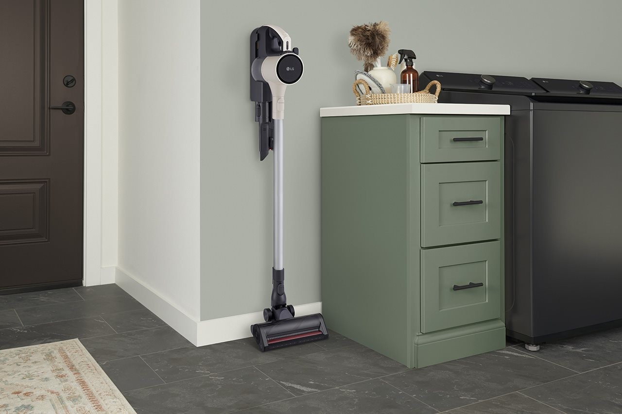 Wall mount charging doc with cordless vacuum next to a counter in the laundry room