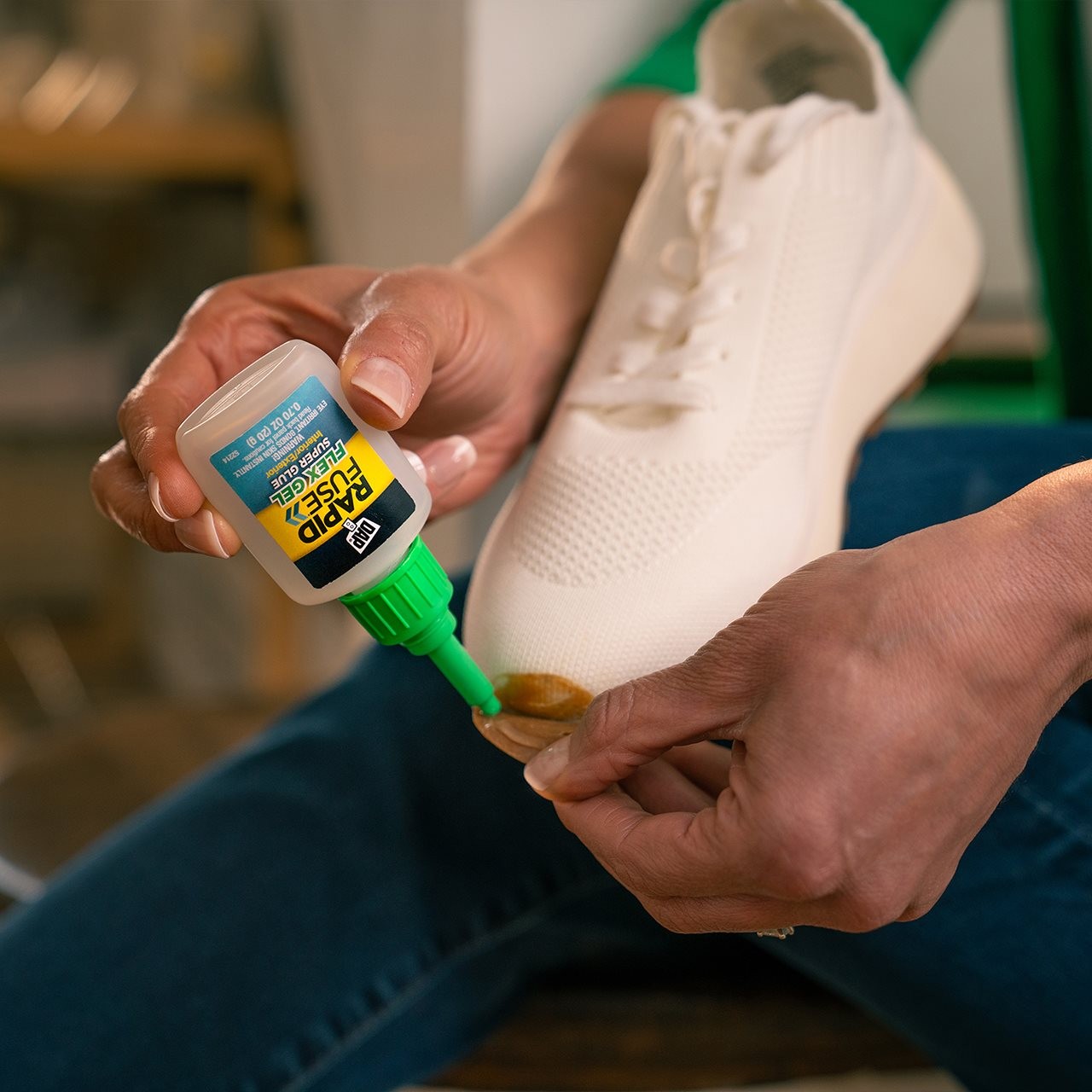 Person using rapid fuse gel for fix a shoe