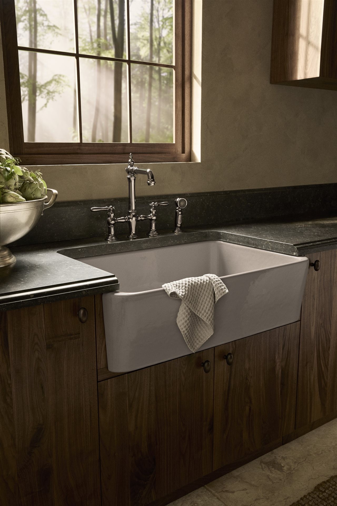 Vintage country sink with green counter tops in kitchen.