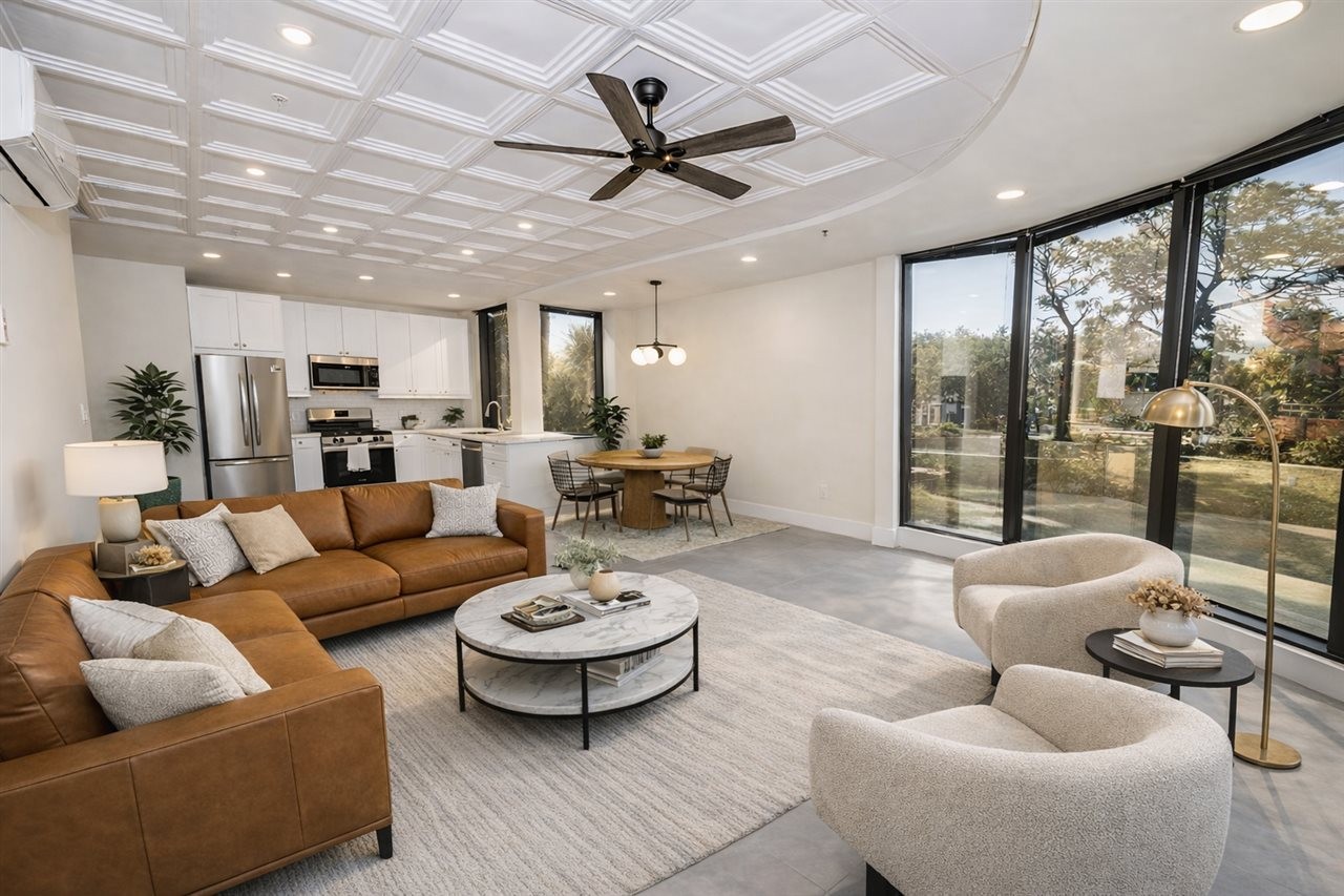 Open concept living room and kitchen in an appartment building. SFA Saniflo above-floor plumbing systems address the multiple needs of a remodeling project.