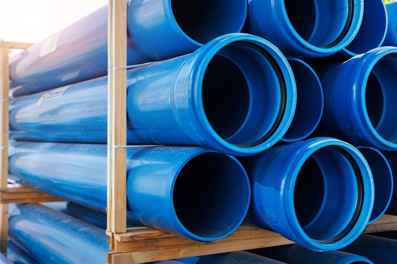 Blue PVC pipes stacked on a truck. Vinyl Institute says can PVC safely supply hot and cold water for homes.