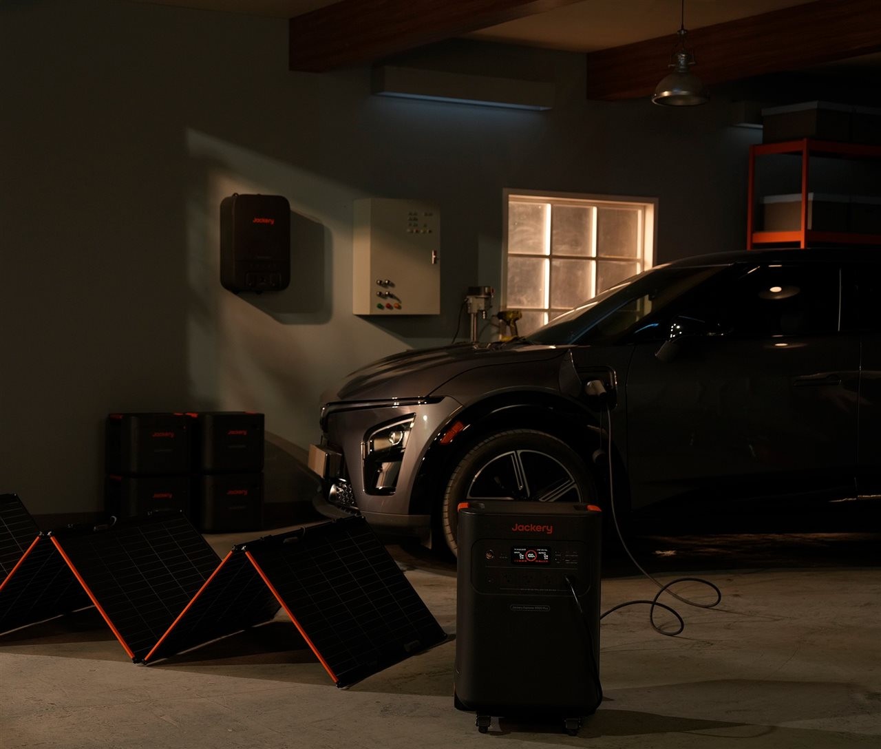 Jackery generator charging an electric vehicle in a garage.
